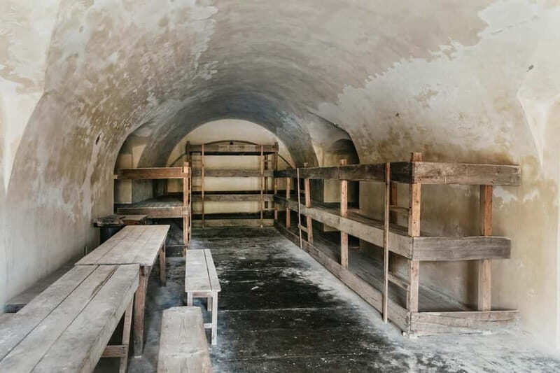 From Prague: Terezin Concentration Camp Guided Tour w/ Audio - Comfortable planning: shoes, headphones, and rain-or-shine reality